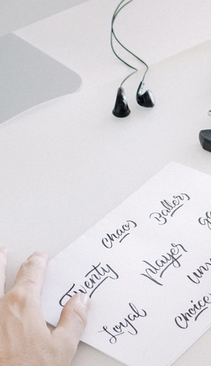 Notes and creative materials laid out on an office desk