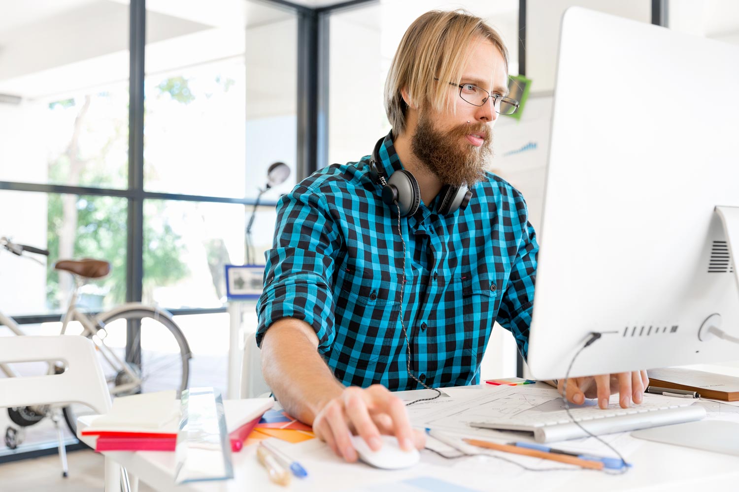 Thompson Recruitment consultant working at a desk in a modern office